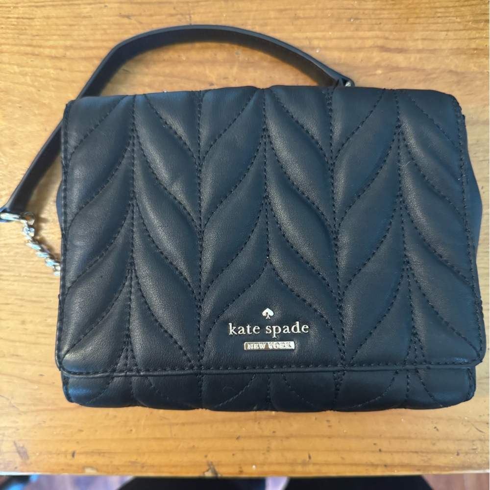 Like new black Kate Spade quilted Crossbody with gold chain.